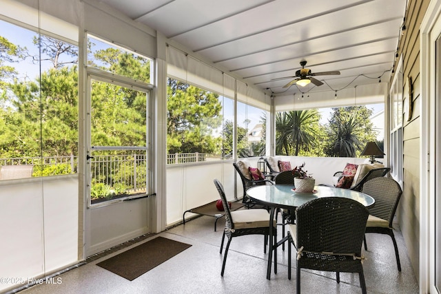 1443 Ellsworth Dr SW, Ocean Isle Beach, NC 28469 - sunroom with ceiling fan, outdoor dining space, and speckle patterned floor
