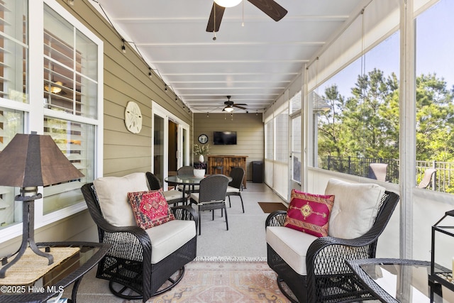 1443 Ellsworth Dr SW, Ocean Isle Beach, NC 28469 - sunroom featuring ceiling fan, healthy amount of natural light, and outdoor dining space
