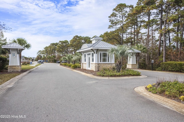 1443 Ellsworth Dr SW, Ocean Isle Beach, NC 28469 - view of asphalt road featuring curbs