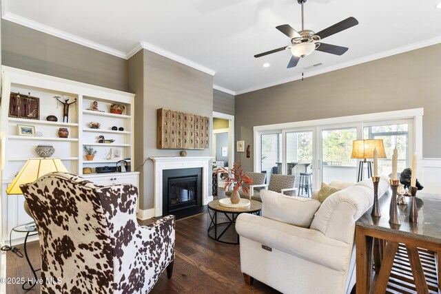 1443 Ellsworth Dr SW, Ocean Isle Beach, NC 28469 - living area with crown molding, a ceiling fan, dark wood-style floors, a glass covered fireplace, and recessed lighting