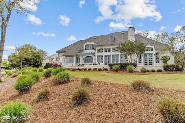 605 Dundee Dr, Wilmington, NC 28405 - rear view of property featuring a chimney and a lawn