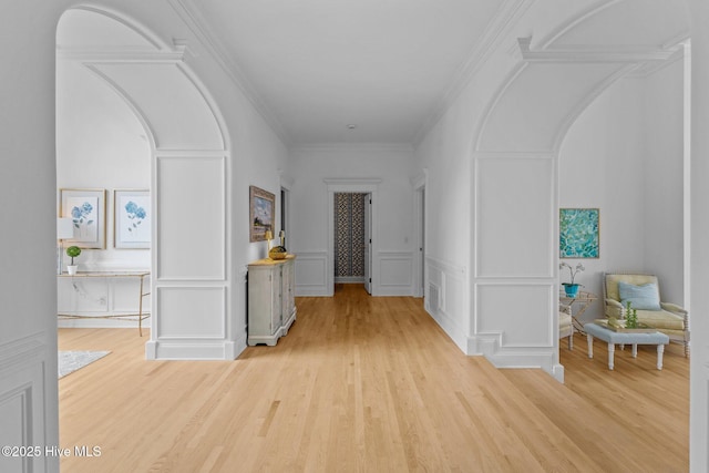 605 Dundee Dr, Wilmington, NC 28405 - hallway featuring wood finished floors, a decorative wall, arched walkways, and ornamental molding