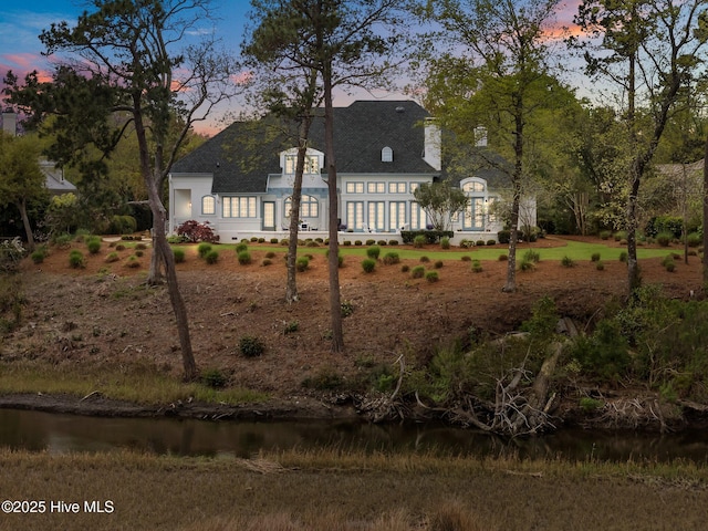 605 Dundee Dr, Wilmington, NC 28405 - french country inspired facade featuring roof with shingles