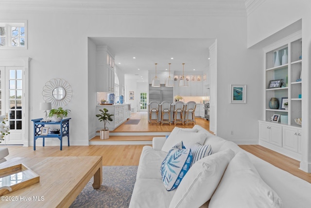 605 Dundee Dr, Wilmington, NC 28405 - living area featuring light wood-style floors, ornamental molding, recessed lighting, baseboards, and built in features