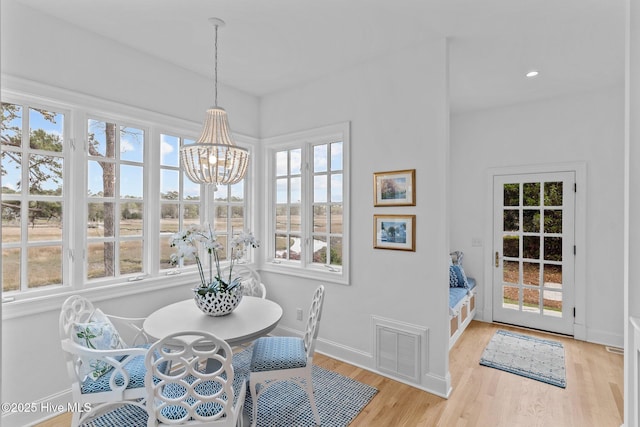605 Dundee Dr, Wilmington, NC 28405 - dining room with baseboards, plenty of natural light, light wood-style floors, a chandelier, and recessed lighting
