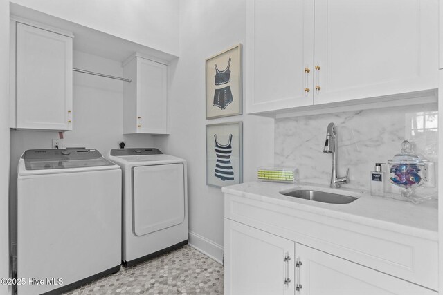 605 Dundee Dr, Wilmington, NC 28405 - clothes washing area with cabinet space, washer and clothes dryer, baseboards, and light floors