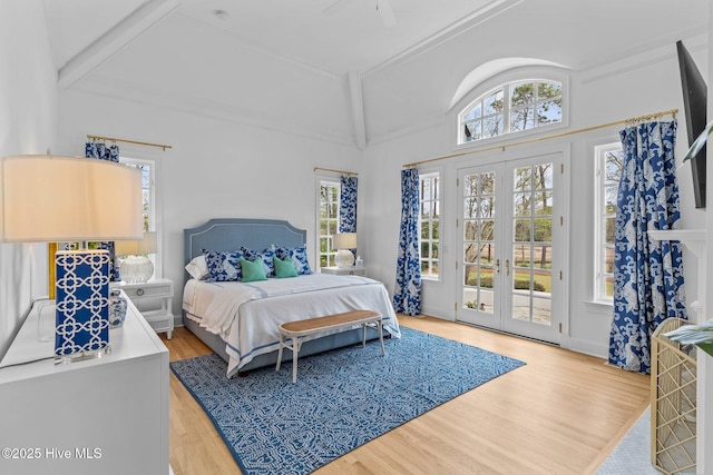 605 Dundee Dr, Wilmington, NC 28405 - bedroom with access to outside, lofted ceiling, french doors, wood finished floors, and multiple windows