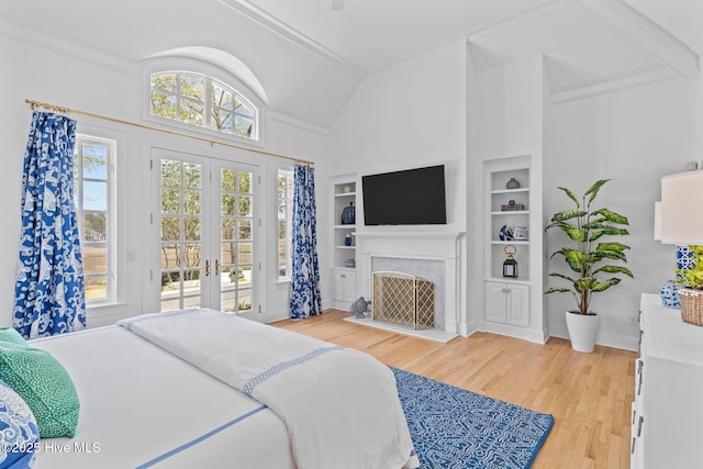 605 Dundee Dr, Wilmington, NC 28405 - bedroom with vaulted ceiling, access to outside, french doors, light wood-style floors, and a fireplace