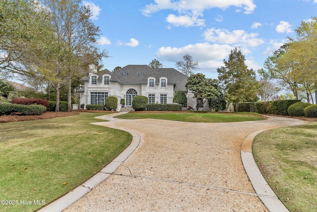 605 Dundee Dr, Wilmington, NC 28405 - french provincial home with a front yard and stucco siding