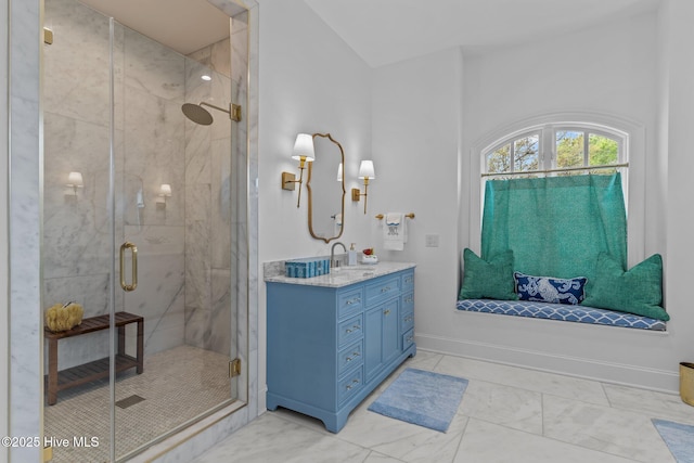 605 Dundee Dr, Wilmington, NC 28405 - bathroom with marble look tiles, vanity, and a shower stall