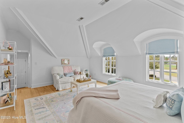 605 Dundee Dr, Wilmington, NC 28405 - bedroom with vaulted ceiling, wood finished floors, and baseboards