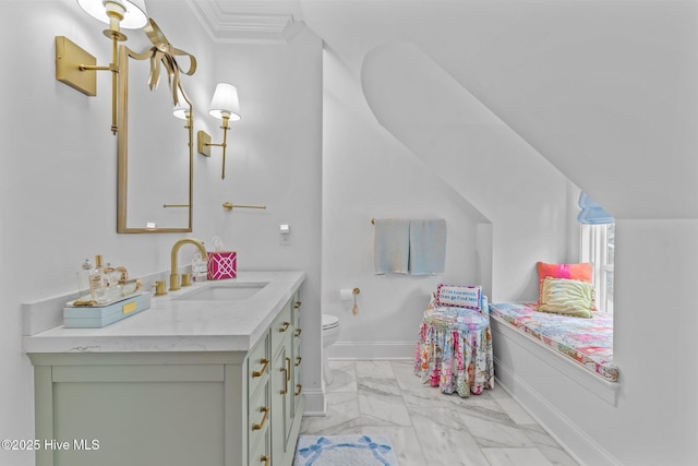 605 Dundee Dr, Wilmington, NC 28405 - bathroom with marble finish floors, toilet, vanity, baseboards, and ornamental molding