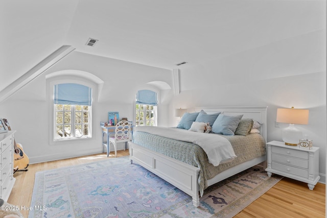 605 Dundee Dr, Wilmington, NC 28405 - bedroom featuring vaulted ceiling and light wood finished floors