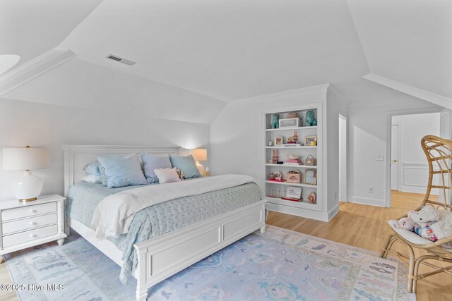 605 Dundee Dr, Wilmington, NC 28405 - bedroom featuring wood finished floors and vaulted ceiling