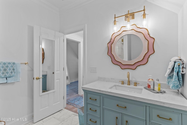 605 Dundee Dr, Wilmington, NC 28405 - bathroom with crown molding, vanity, baseboards, and marble look tiles