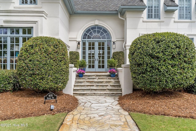 605 Dundee Dr, Wilmington, NC 28405 - doorway to property featuring french doors, stucco siding, and a shingled roof