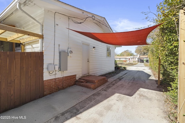view of side of property with entry steps