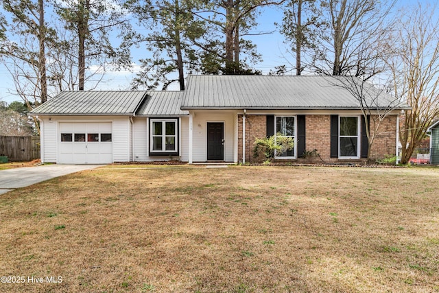 ranch-style house with fence, driveway, a front yard, and an attached garage