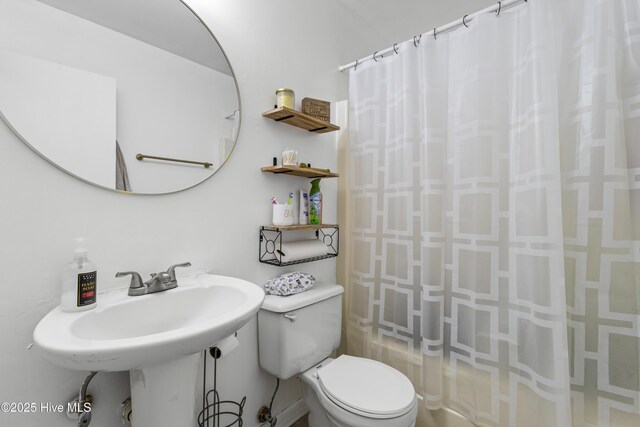bathroom featuring toilet