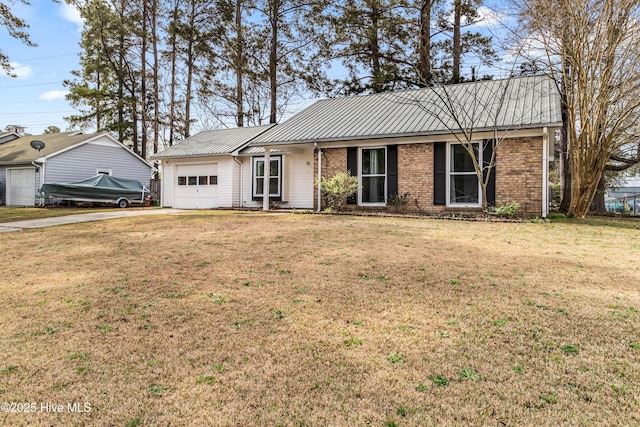 ranch-style home with an attached garage, a front lawn, metal roof, and concrete driveway