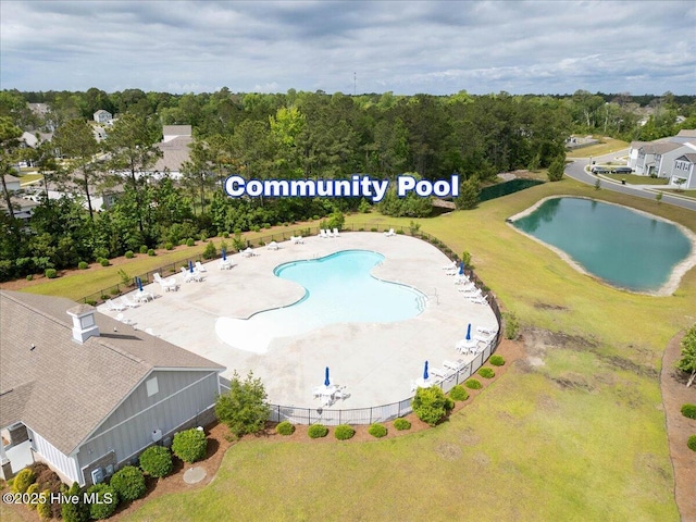 1550 Murre Ct SE, Bolivia, NC 28422 - bird's eye view of a pool and a nearby body of water