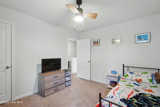 1550 Murre Ct SE, Bolivia, NC 28422 - bedroom with light carpet, baseboards, and a ceiling fan