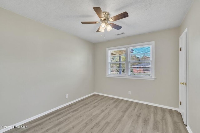 1317 Old Grantham Rd, Goldsboro, NC 27530 - spare room with light wood-type flooring, a textured ceiling, and ceiling fan