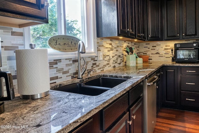 8713 Emerald Plantation Rd, Emerald Isle, NC 28594 - kitchen featuring a sink, tasteful backsplash, light stone counters, and dishwasher
