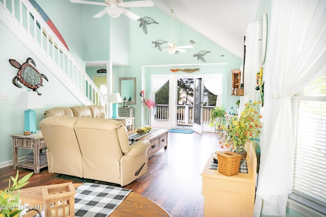 8713 Emerald Plantation Rd, Emerald Isle, NC 28594 - living area with a ceiling fan, wood finished floors, high vaulted ceiling, and stairway