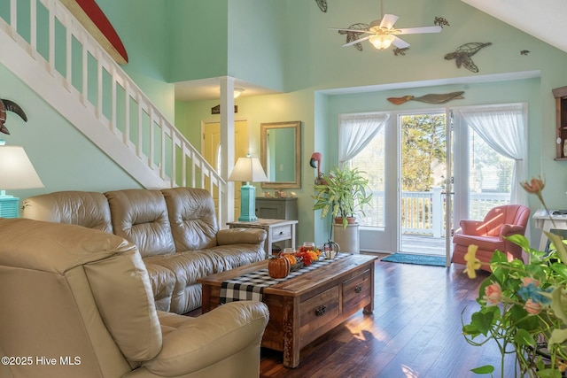 8713 Emerald Plantation Rd, Emerald Isle, NC 28594 - living area with a ceiling fan, wood finished floors, high vaulted ceiling, and stairway