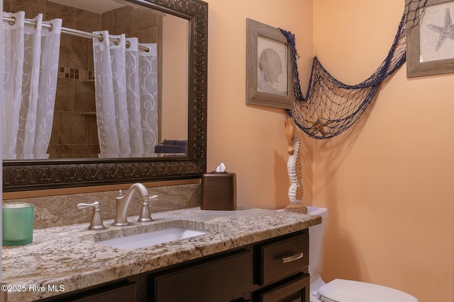 8713 Emerald Plantation Rd, Emerald Isle, NC 28594 - bathroom with vanity, toilet, and a shower with curtain