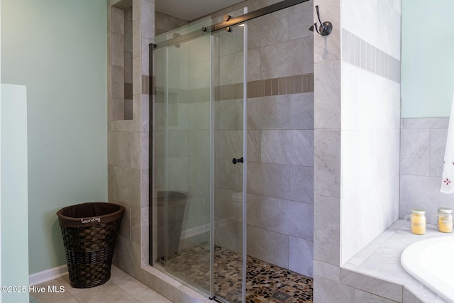 8713 Emerald Plantation Rd, Emerald Isle, NC 28594 - bathroom with a shower stall, a garden tub, and tile patterned floors