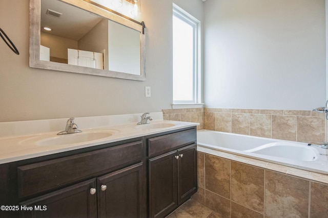 117 NW River Dr, Moyock, NC 27958 - kitchen with a breakfast bar area, stainless steel appliances, dark brown cabinetry, and light stone countertops