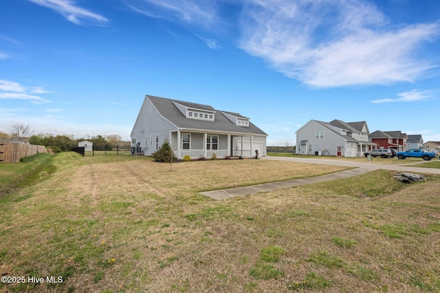 117 NW River Dr, Moyock, NC 27958 - back of property featuring fence, an outdoor hangout area, a patio area, french doors, and a lawn