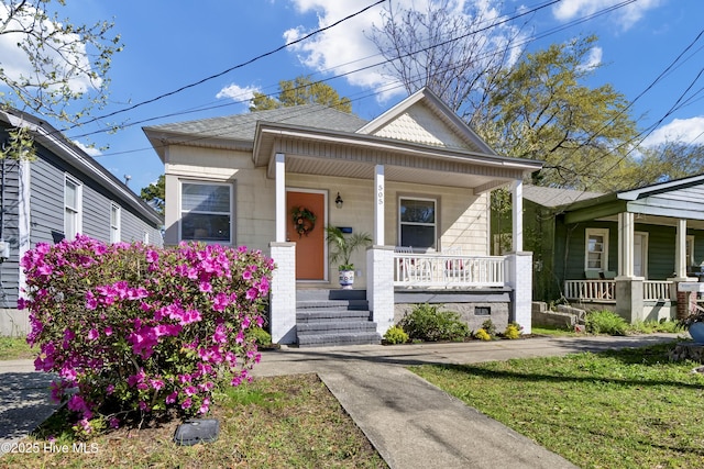 bungalow featuring a shingled roof and covered porch