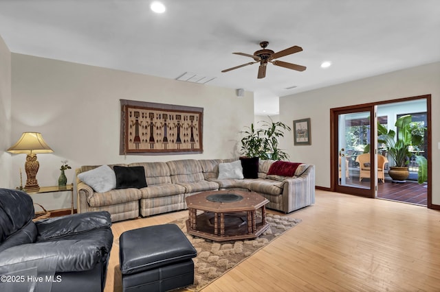 living room featuring a ceiling fan, wood finished floors, baseboards, visible vents, and recessed lighting