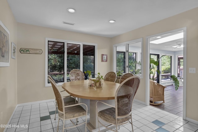 dining room featuring light tile patterned flooring, baseboards, visible vents, and recessed lighting