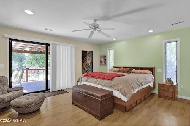 bedroom with access to exterior, recessed lighting, and light wood-type flooring