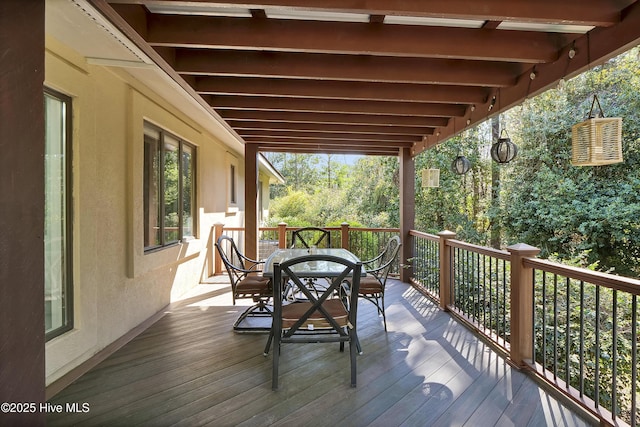 wooden deck with outdoor dining area