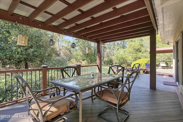 wooden terrace with outdoor dining space