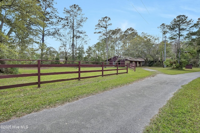 view of street featuring aphalt driveway