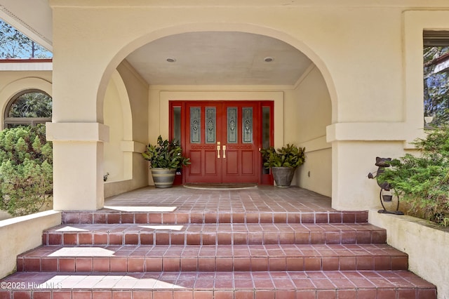 property entrance featuring stucco siding