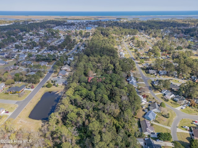 birds eye view of property with a residential view and a water view