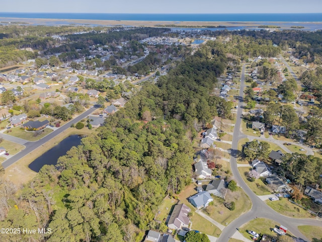 bird's eye view with a residential view and a water view