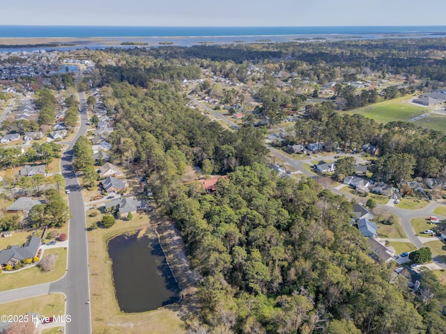 birds eye view of property featuring a residential view and a water view