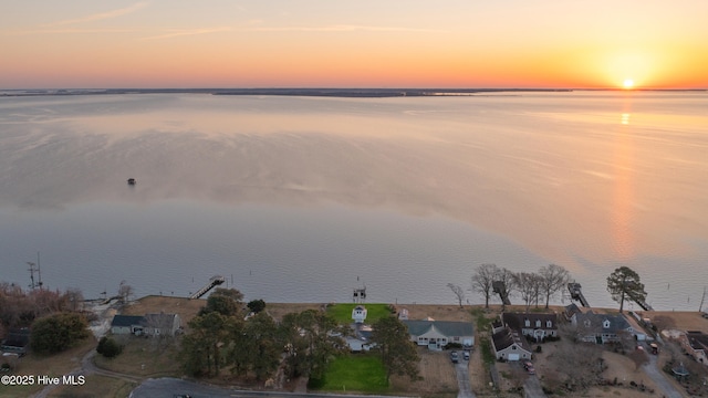 aerial view at dusk with a water view