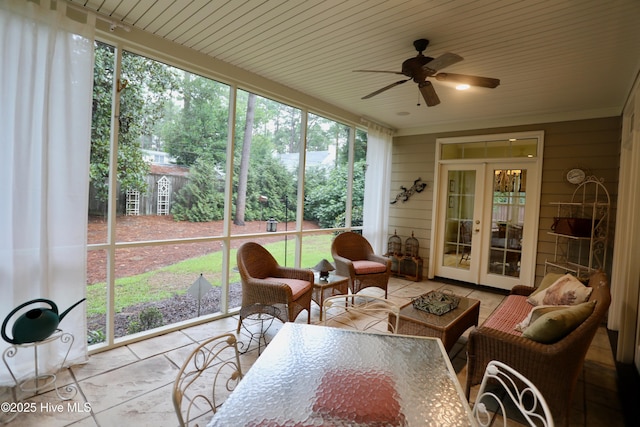 sunroom featuring ceiling fan, plenty of natural light, french doors, and an outdoor hangout area