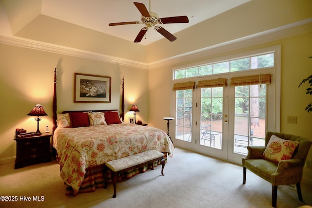 bedroom featuring a raised ceiling, access to exterior, ceiling fan, and light colored carpet
