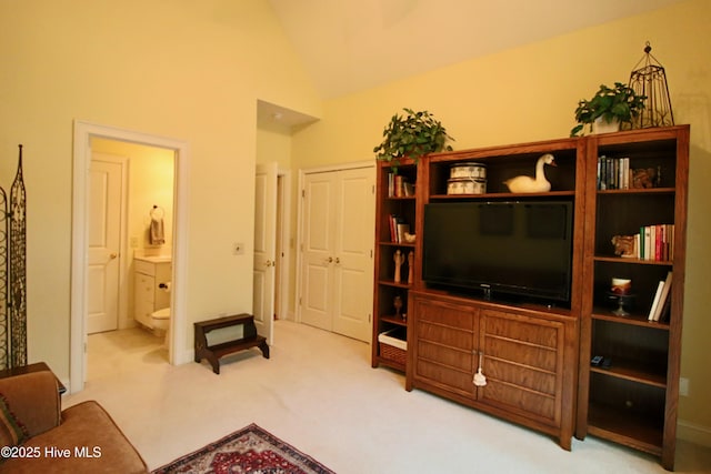 living room featuring carpet flooring, high vaulted ceiling, and baseboards