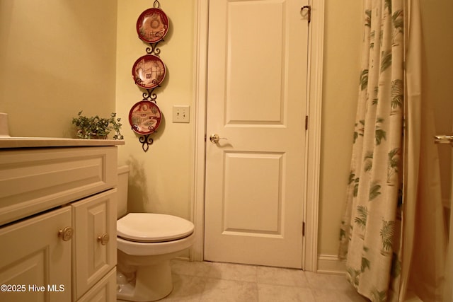 full bath featuring toilet, tile patterned flooring, and vanity